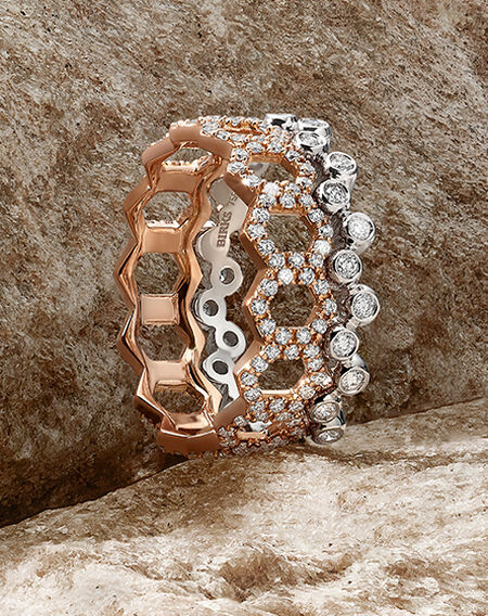 Birks Iconic Stackable rings on a brown rock background