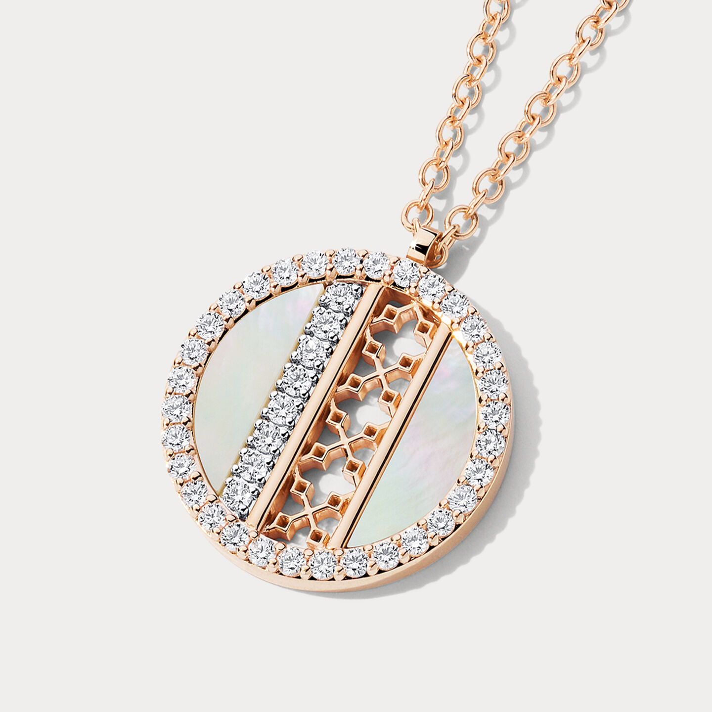 Birks Dare to Dream mother-of-pearl and diamond pendant on a greyish beige background.