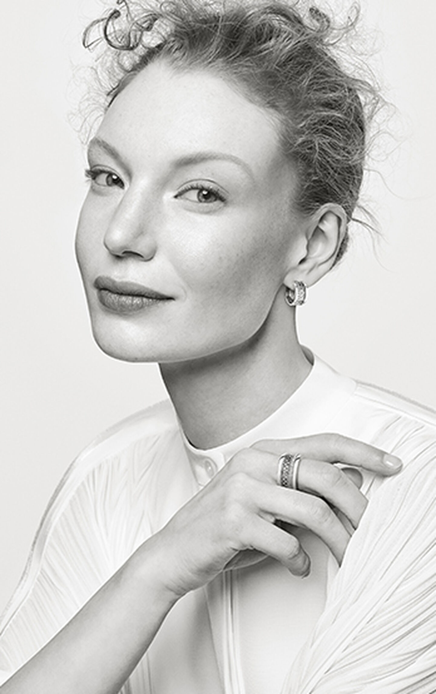 black and white model wears Dare to Dream collection jewelry