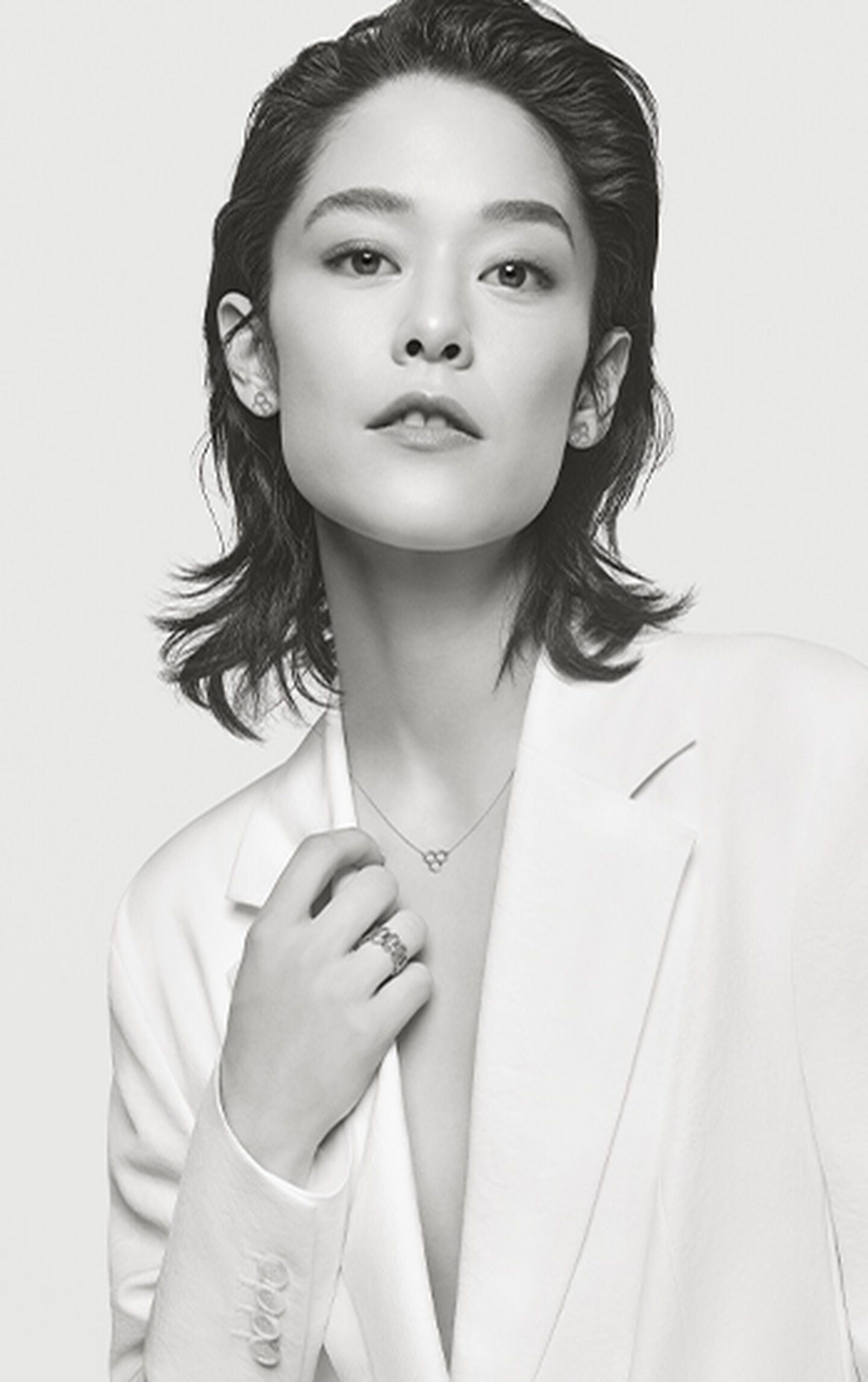black and white model wears bee chic collection jewelry
