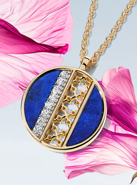 Birks Dare to Dream lapis lazuli pendant on a flower background.