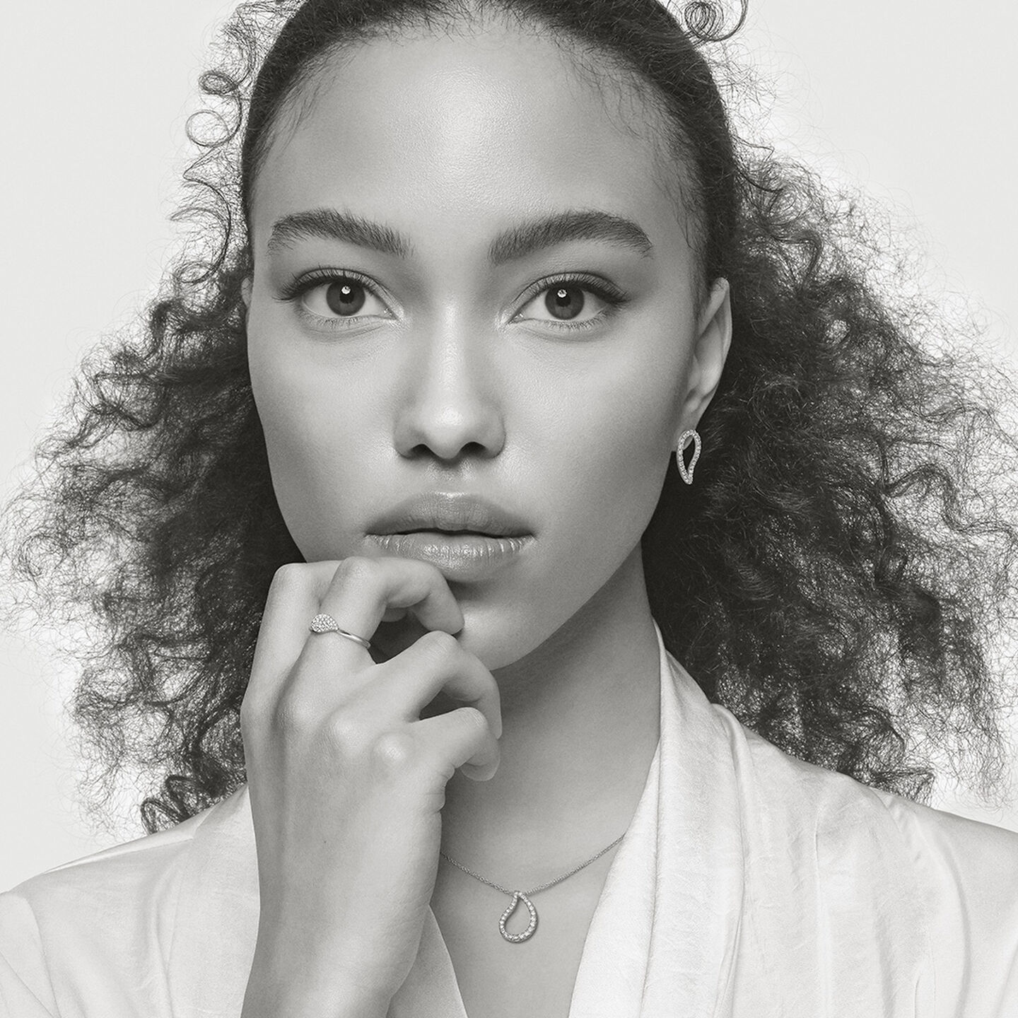Black and white photo of a model wearing Birks Petale